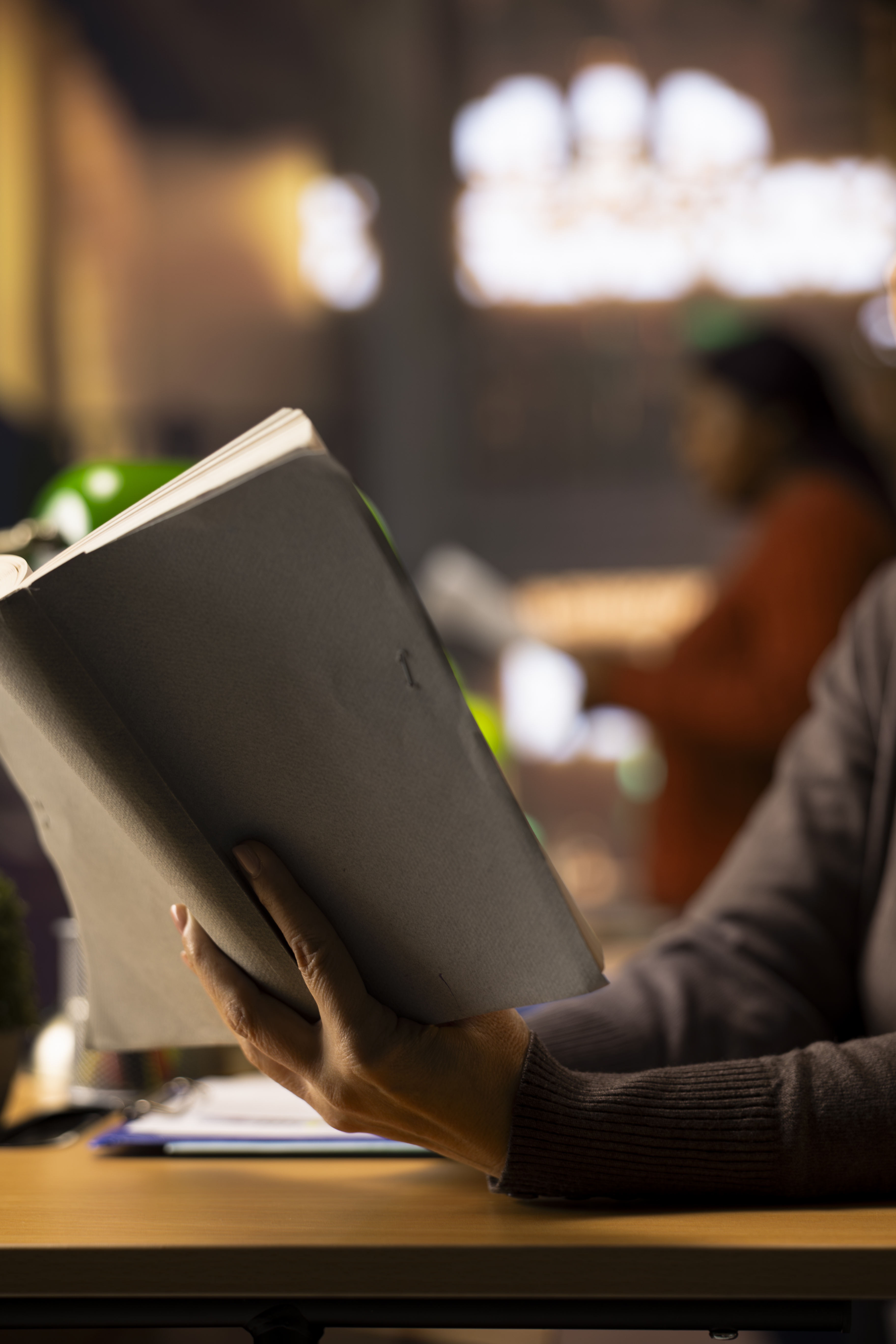 Female university student working on her thesis in a campus library study area