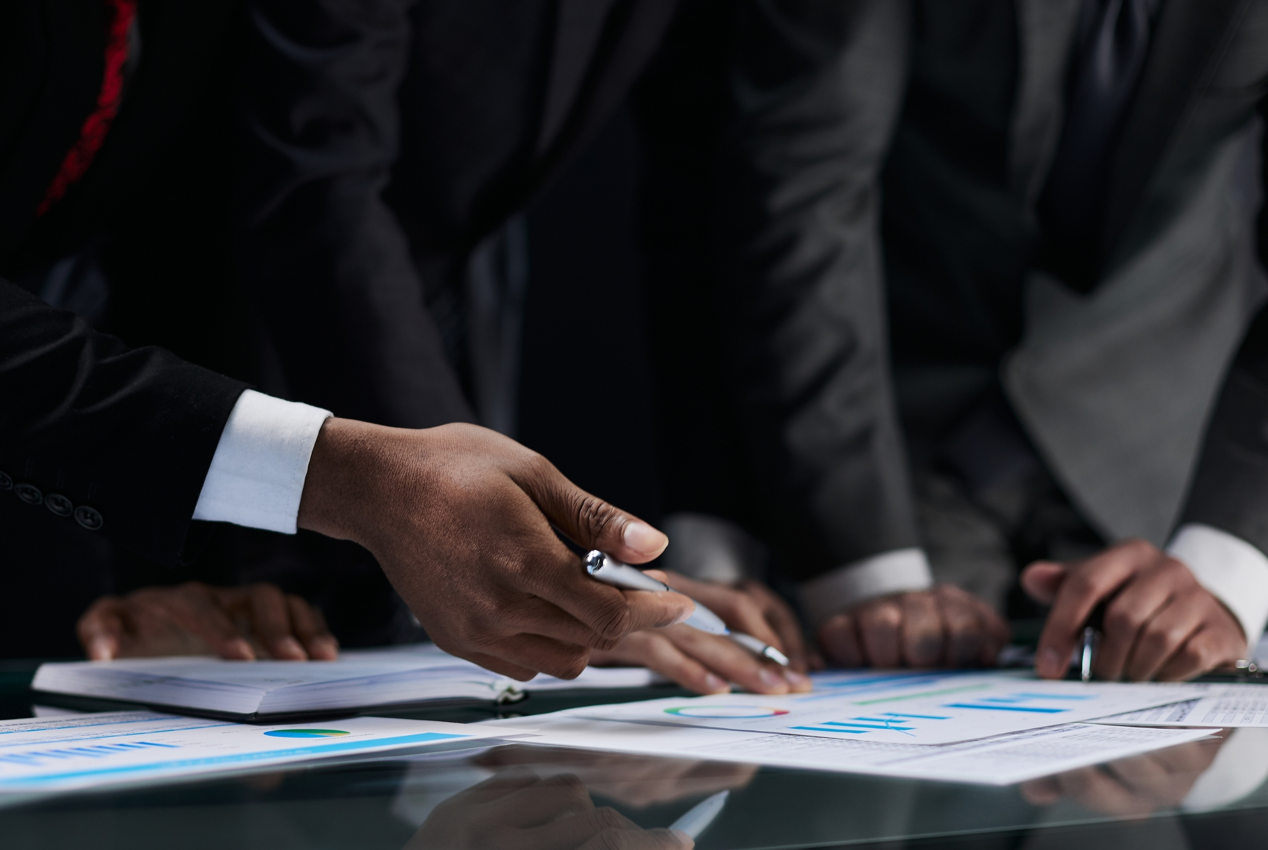business-colleagues-look-graph-table-from