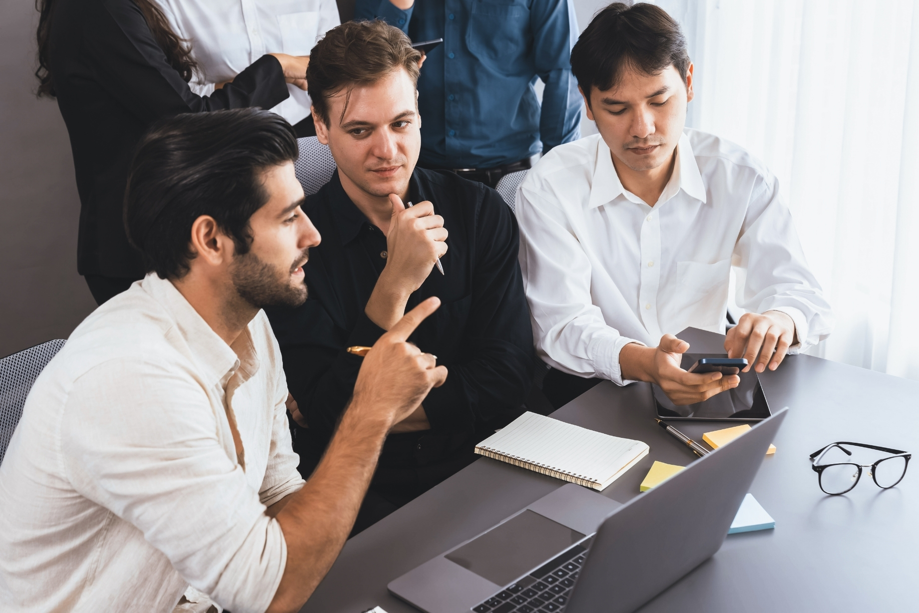 Diverse professionals collaborating in an office setting
