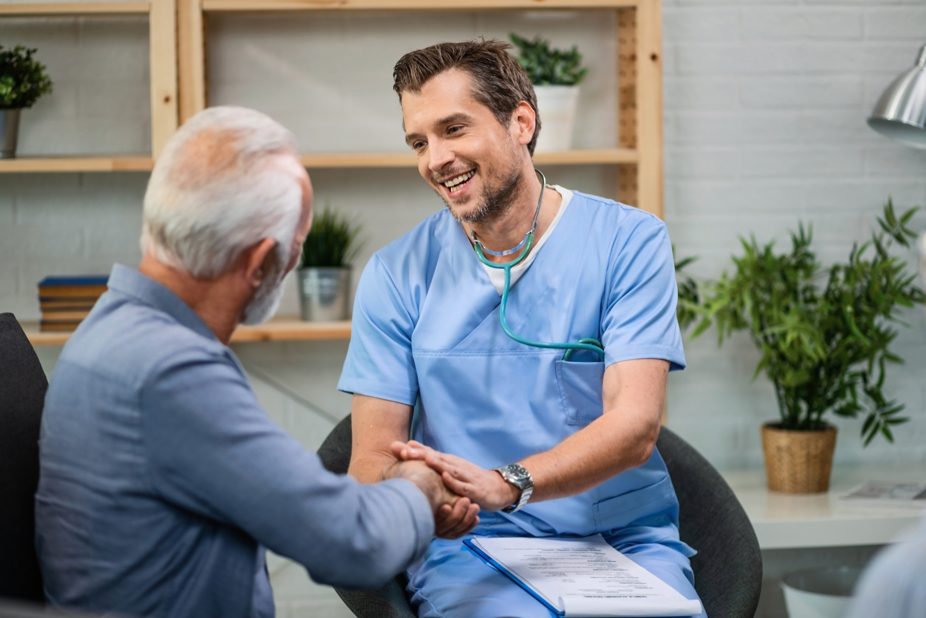 Healthcare professional meeting with a senior patient during a home visit